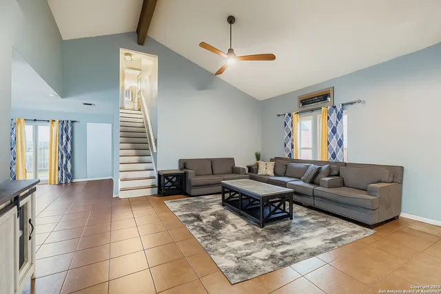 a kitchen with stainless steel appliances kitchen island granite countertop a sink stove and refrigerator