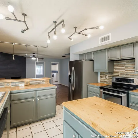 a view of a dining room with furniture and window