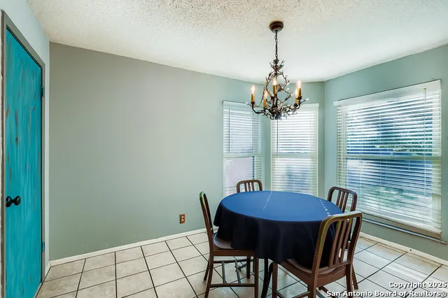a view of empty room with wooden floor and fireplace
