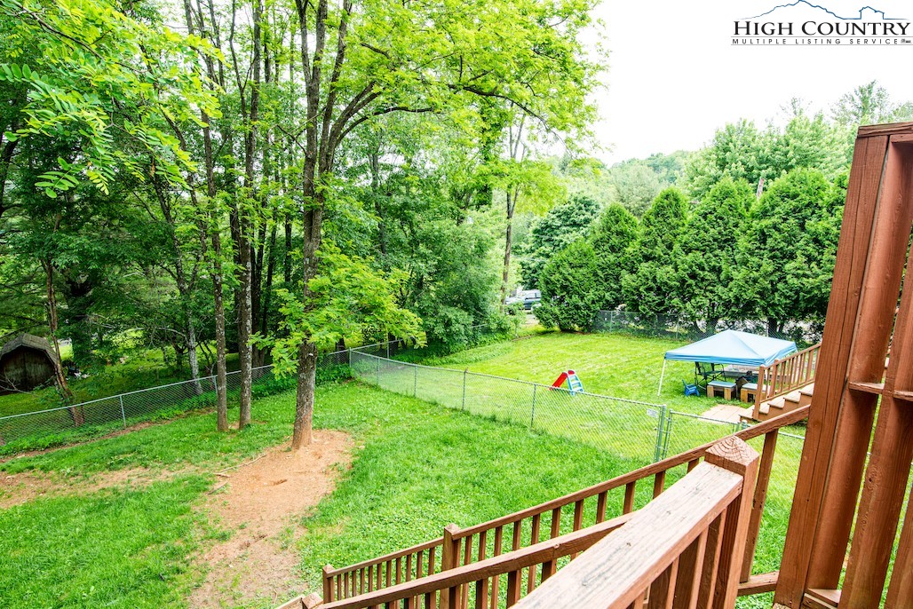 306 Margot Road, Unit 1 & 2 Boone, NC 28607 - Photo 8 of 8 a view of a garden and deck
