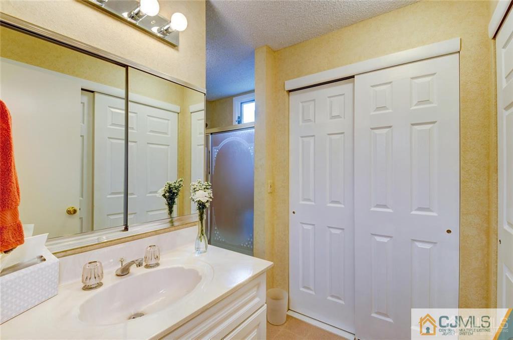 781 A Risley Road Monroe Township, NJ 08831 - Photo 13 of 21 a bathroom with a sink and a mirror