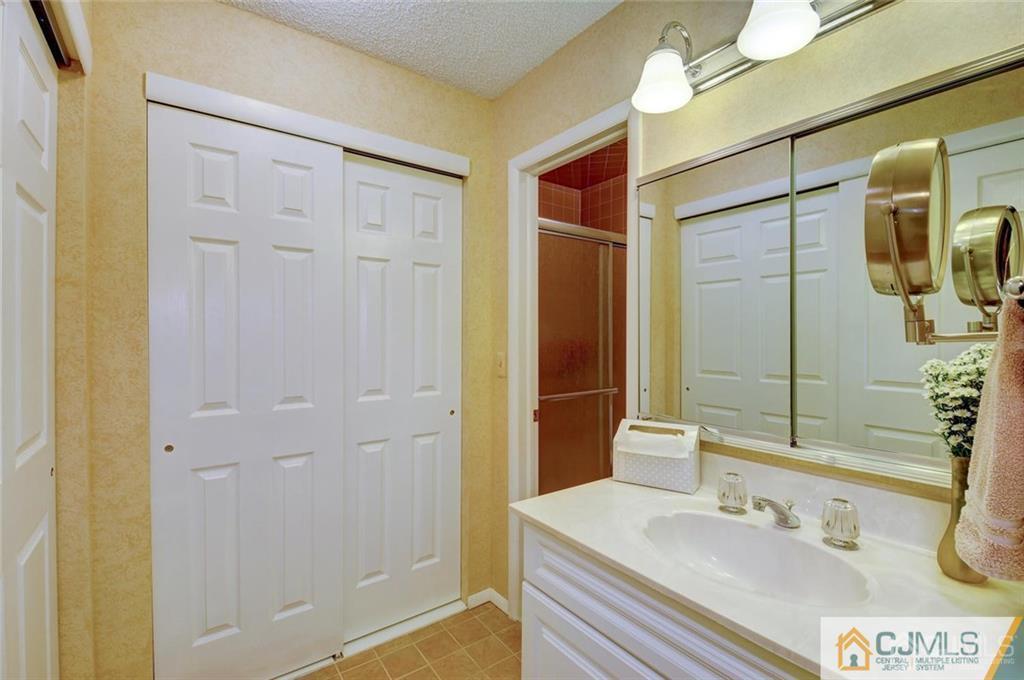 781 A Risley Road Monroe Township, NJ 08831 - Photo 14 of 21 a bathroom with a sink and a mirror