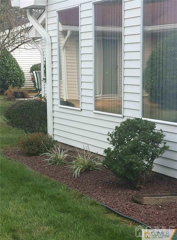 781 A Risley Road Monroe Township, NJ 08831 - Photo 20 of 21 a view of a backyard with plants and large tree