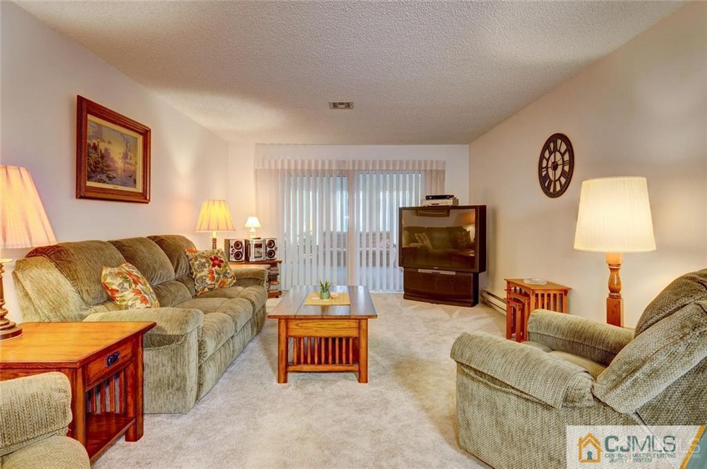 781 A Risley Road Monroe Township, NJ 08831 - Photo 4 of 21 a living room with furniture and a lamp