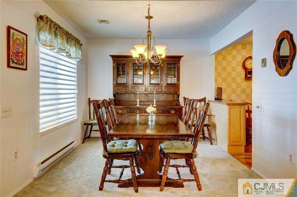 781 A Risley Road Monroe Township, NJ 08831 - Photo 6 of 21 a view of a dining room with furniture and window