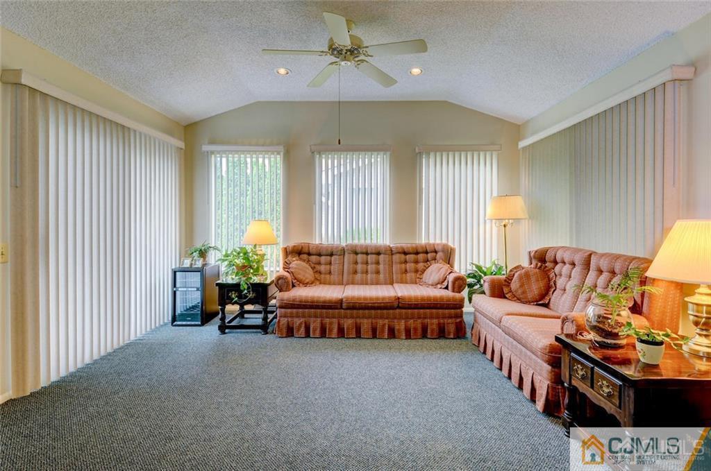 781 A Risley Road Monroe Township, NJ 08831 - Photo 10 of 21 a living room with furniture and a large window