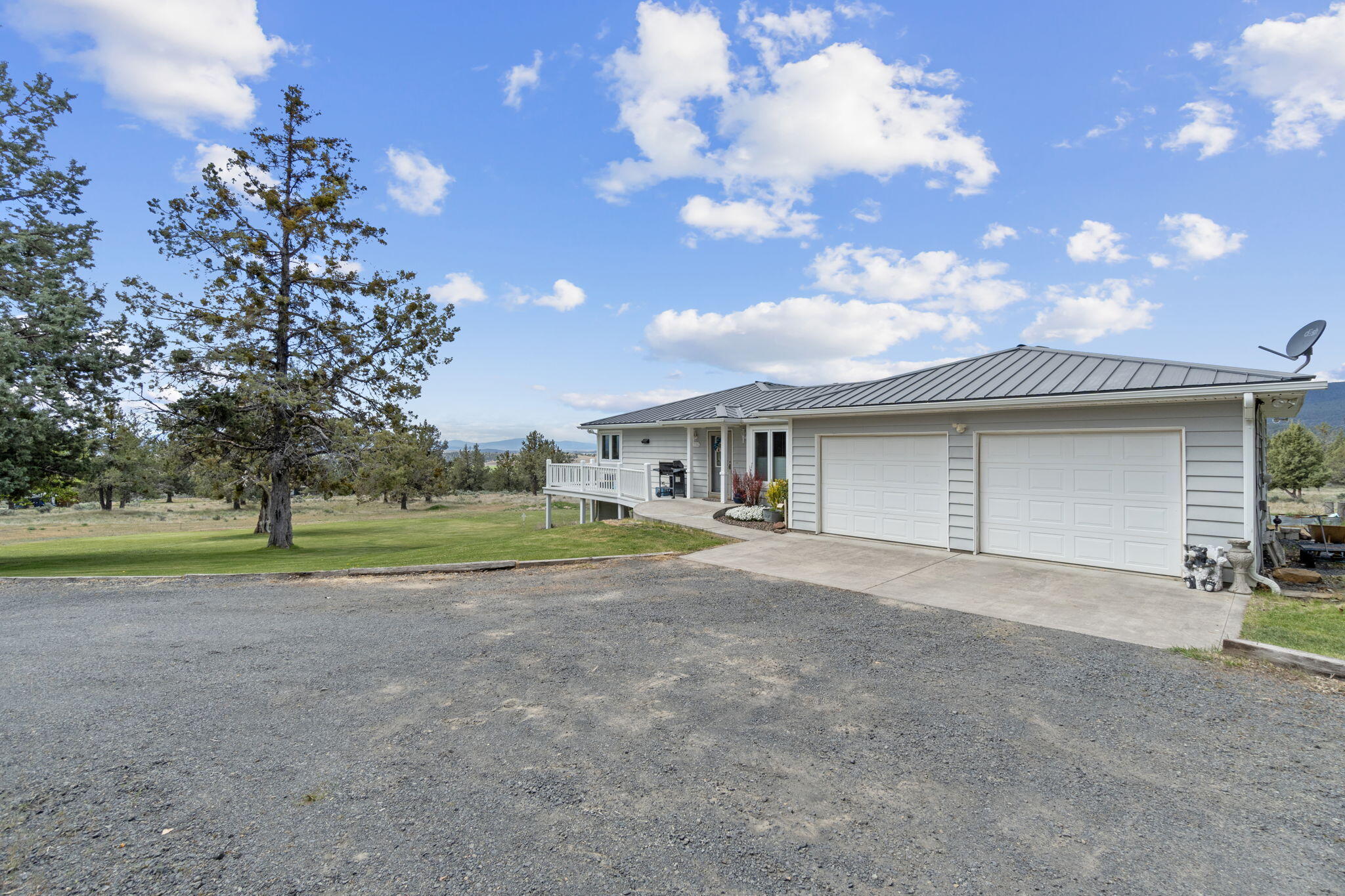 17722 Pope Road Merrill, OR 97633 - Photo 4 of 61 a view of a house with a yard and garage
