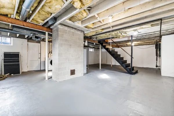 a view of an empty room with white walls