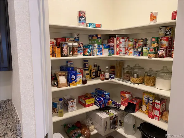 a room with storage and a shelf