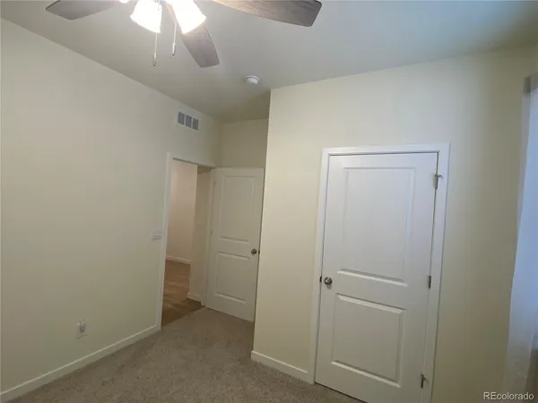 an empty room with a bathroom