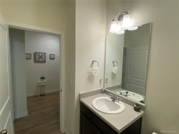 a bathroom with a sink double vanity and a mirror