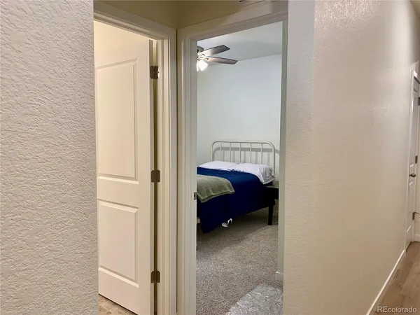 a bedroom with a bed and a mirror