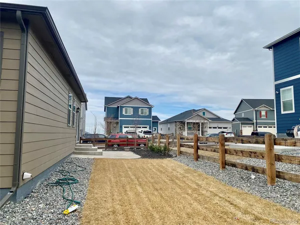 a view of house with outdoor space and sitting area