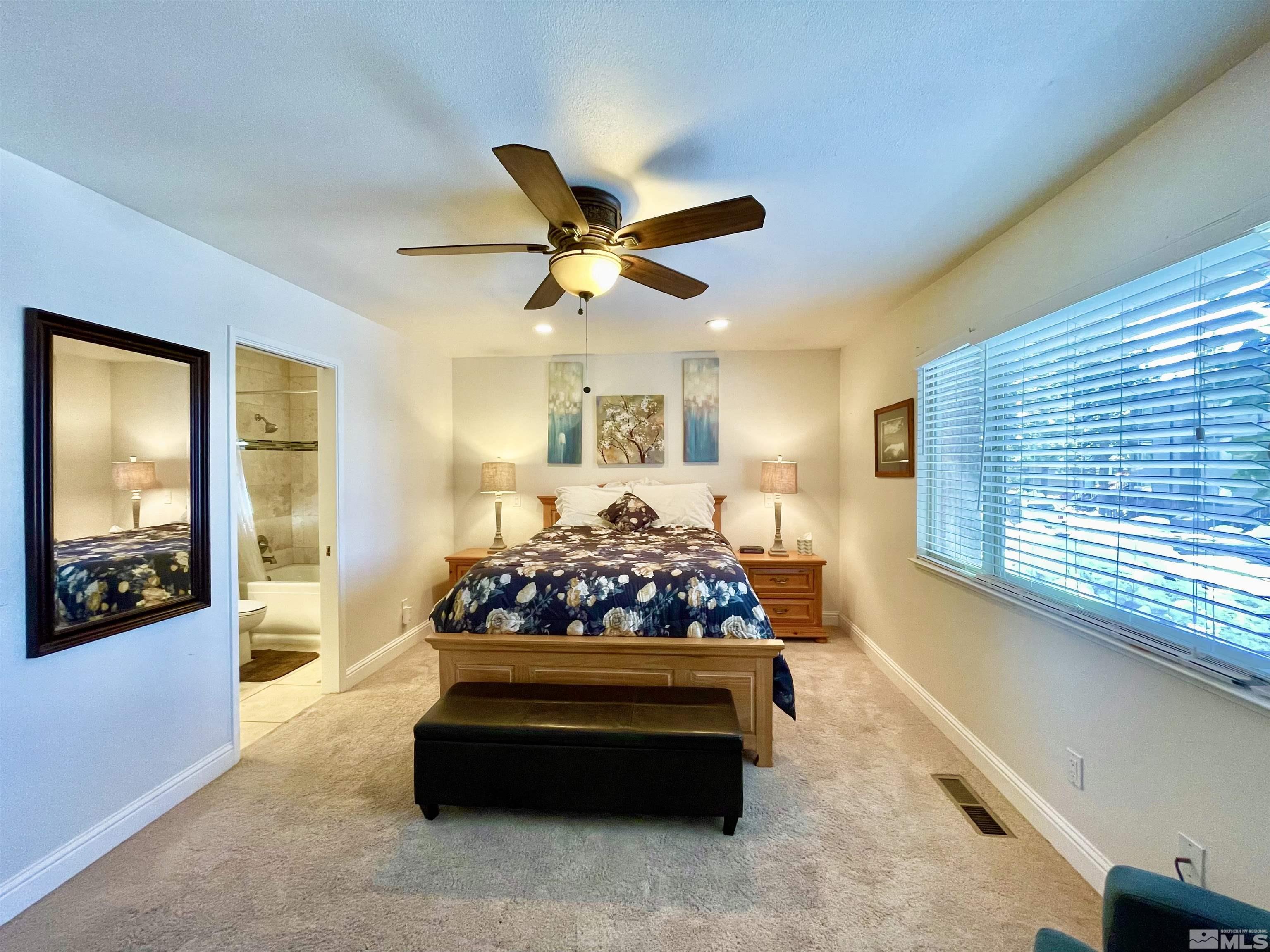 126 Spooner Lane, Unit B Stateline, NV 89449 - Photo 20 of 37 a living room with furniture and a large window