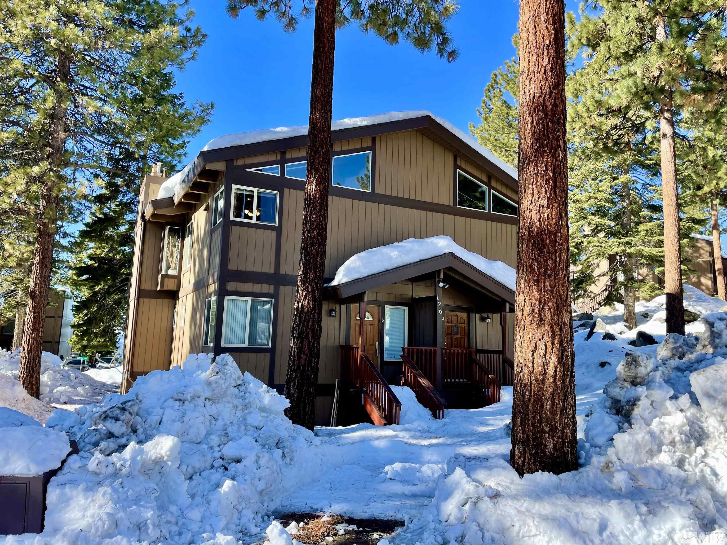 126 Spooner Lane, Unit B Stateline, NV 89449 - Photo 2 of 37 a view of a house with wooden fence