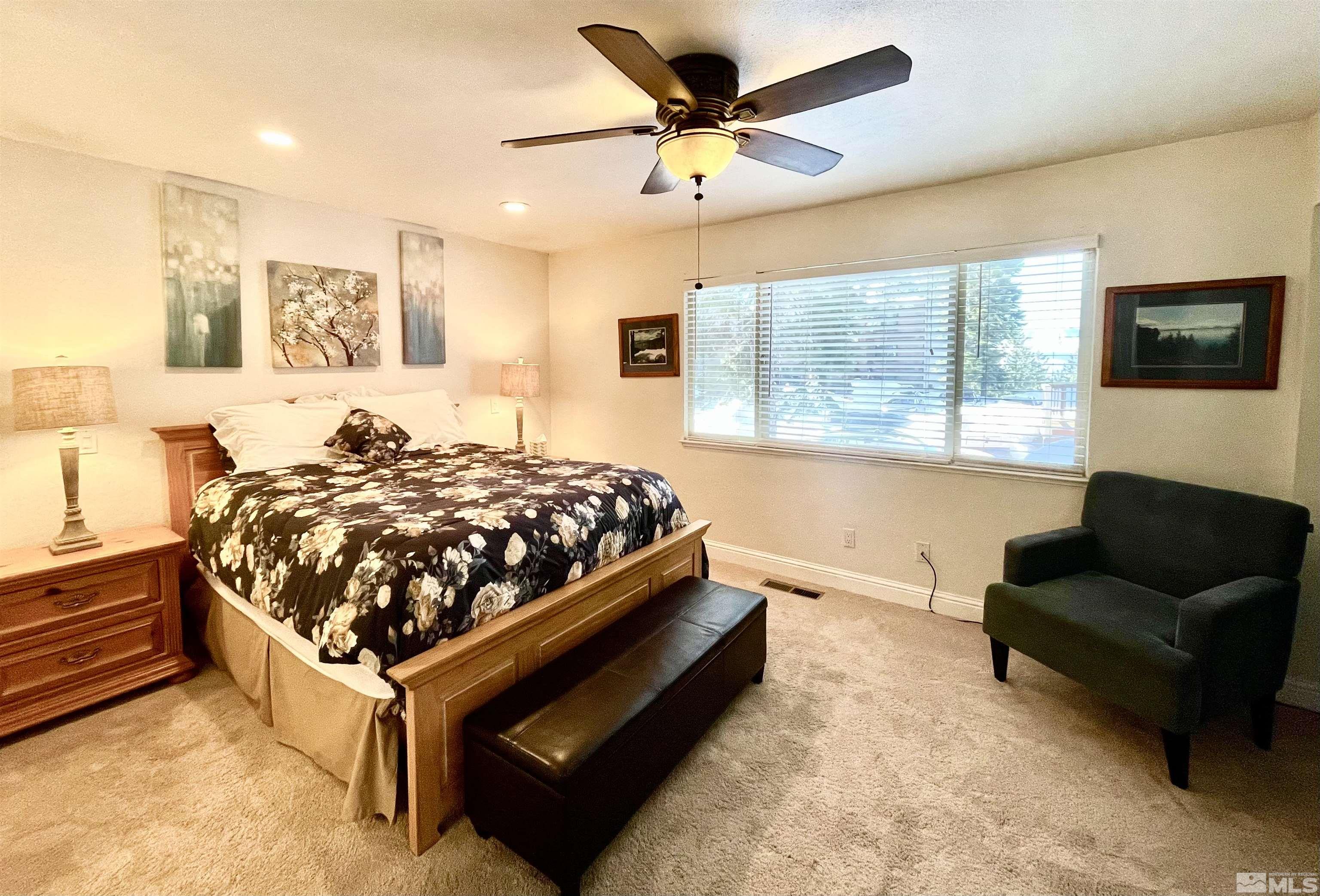 126 Spooner Lane, Unit B Stateline, NV 89449 - Photo 21 of 37 a bedroom with a bed and a couch