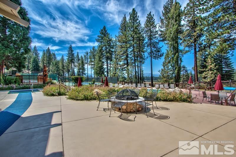 126 Spooner Lane, Unit B Stateline, NV 89449 - Photo 31 of 37 a view of a patio with couches and a fire pit
