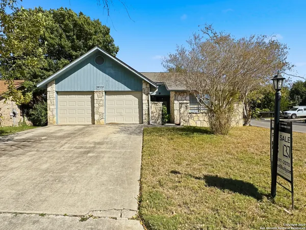a front view of a house with yard