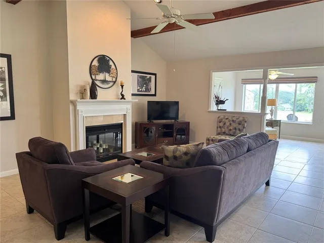 a living room with furniture a rug and a fireplace