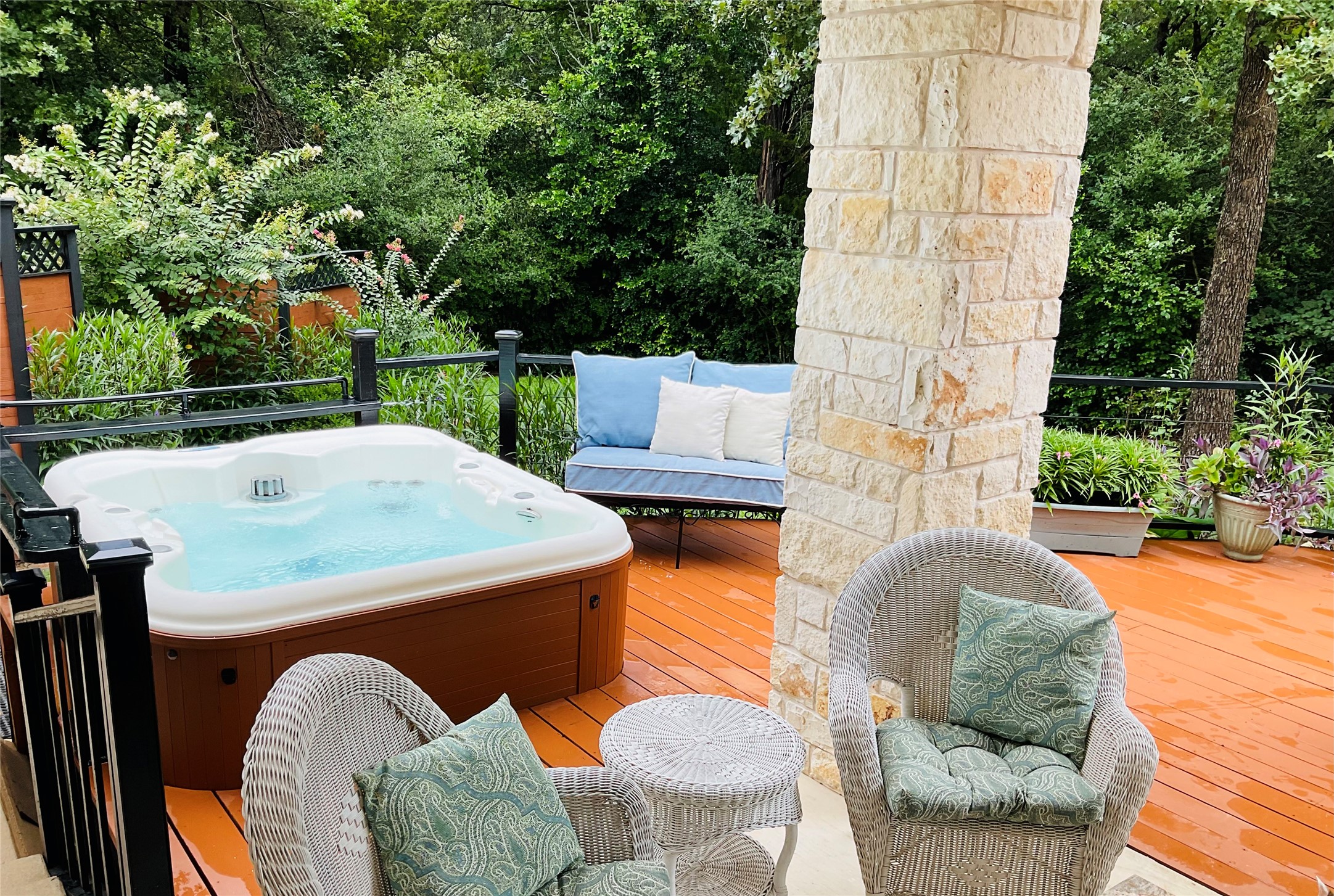 118 Loblolly Elgin, TX 78621 - Photo 27 of 31 Hot tub with wooded privacy and lots of flowers