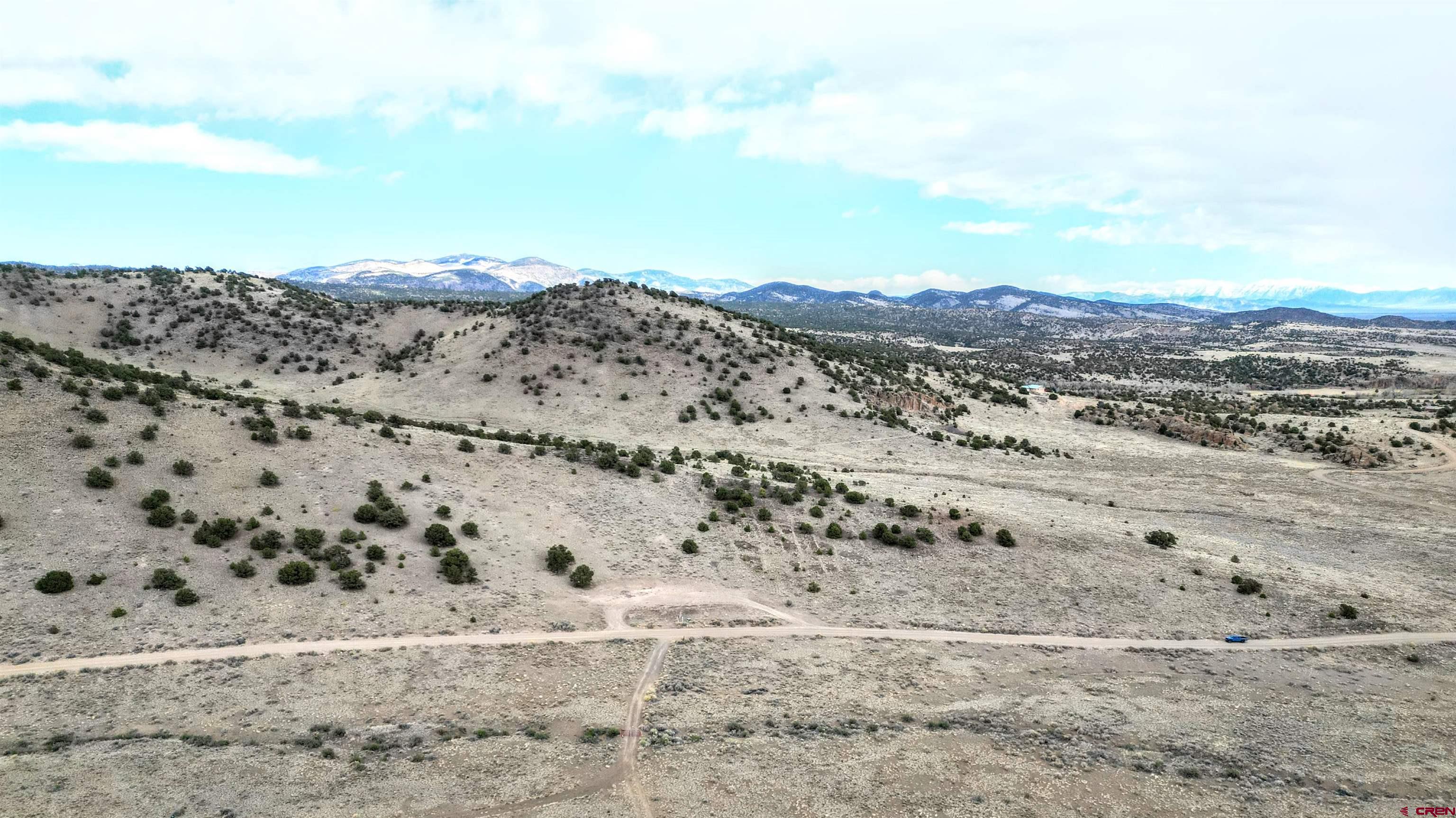 17 Ghost Mine Ranch Del Norte, CO 81132 - Photo 12 of 33 a view of mountain view with wooden floor and mountains in the back