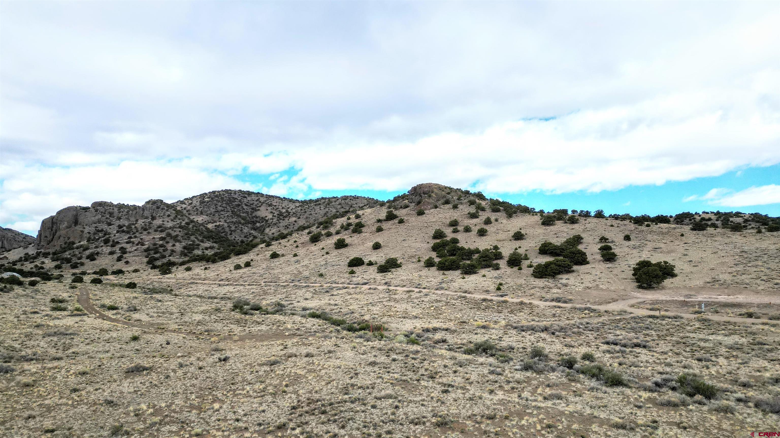 17 Ghost Mine Ranch Del Norte, CO 81132 - Photo 21 of 33 a view of a dry yard with a mountain