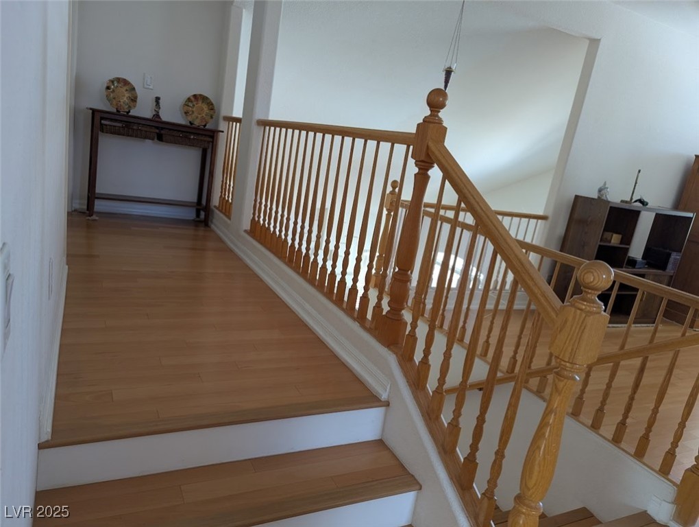 4777 Crakow Court Las Vegas, NV 89147 - Photo 14 of 49 Staircase featuring wood finished floors