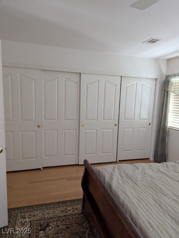 4777 Crakow Court Las Vegas, NV 89147 - Photo 19 of 49 Bedroom with a closet and wood finished floors