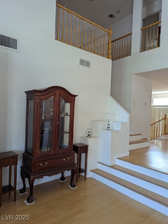 4777 Crakow Court Las Vegas, NV 89147 - Photo 27 of 49 Stairs featuring wood finished floors and a high ceiling