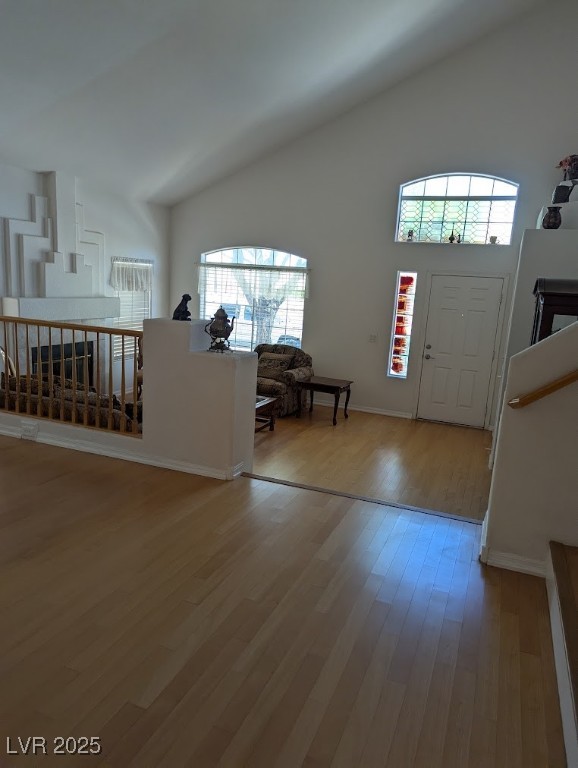 4777 Crakow Court Las Vegas, NV 89147 - Photo 31 of 49 Foyer entrance with plenty of natural light, light wood-style floors, and high vaulted ceiling