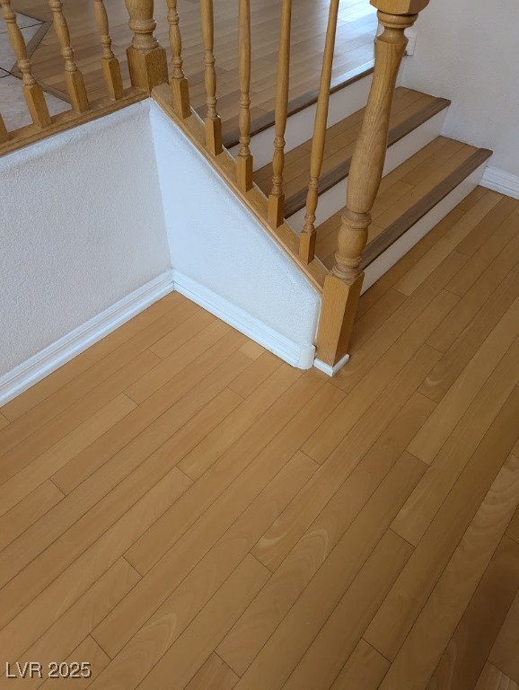 4777 Crakow Court Las Vegas, NV 89147 - Photo 32 of 49 Staircase featuring wood finished floors and baseboards