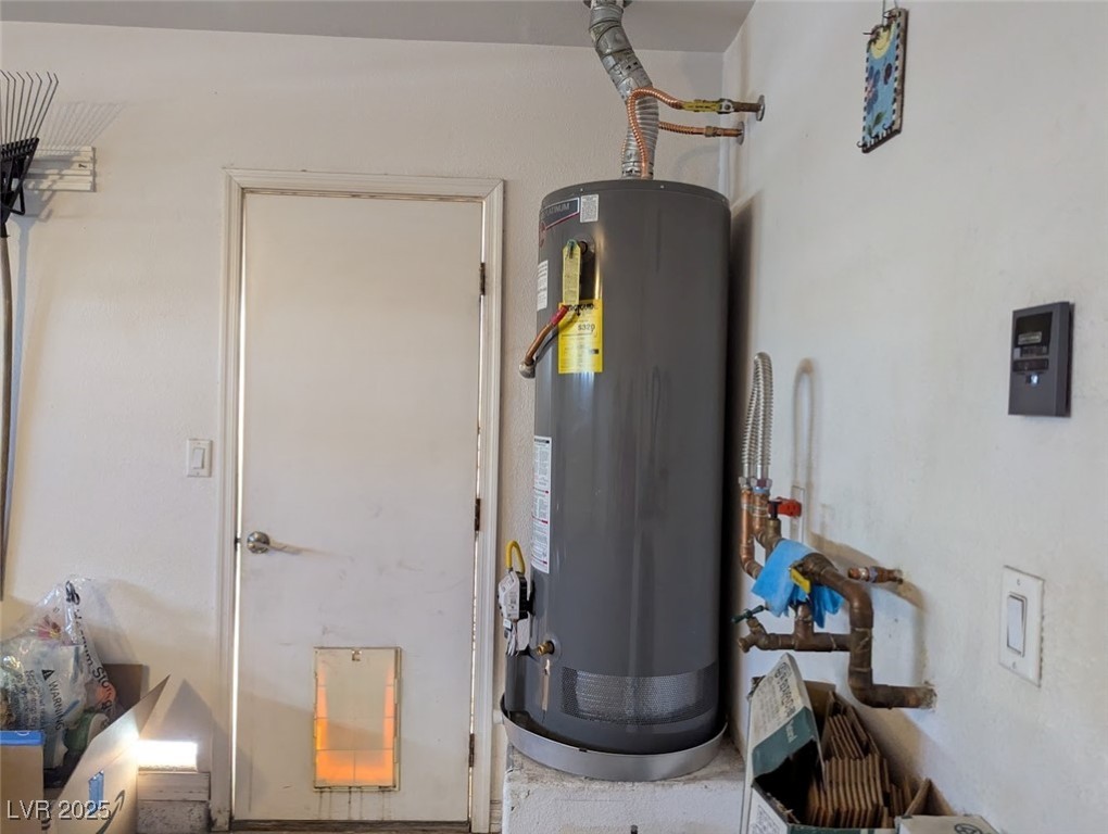 4777 Crakow Court Las Vegas, NV 89147 - Photo 36 of 49 Utility room with water heater