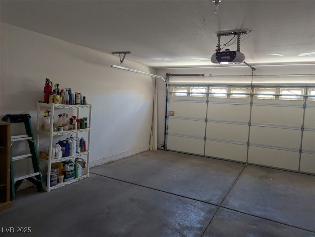 4777 Crakow Court Las Vegas, NV 89147 - Photo 37 of 49 Garage with baseboards and a garage door opener