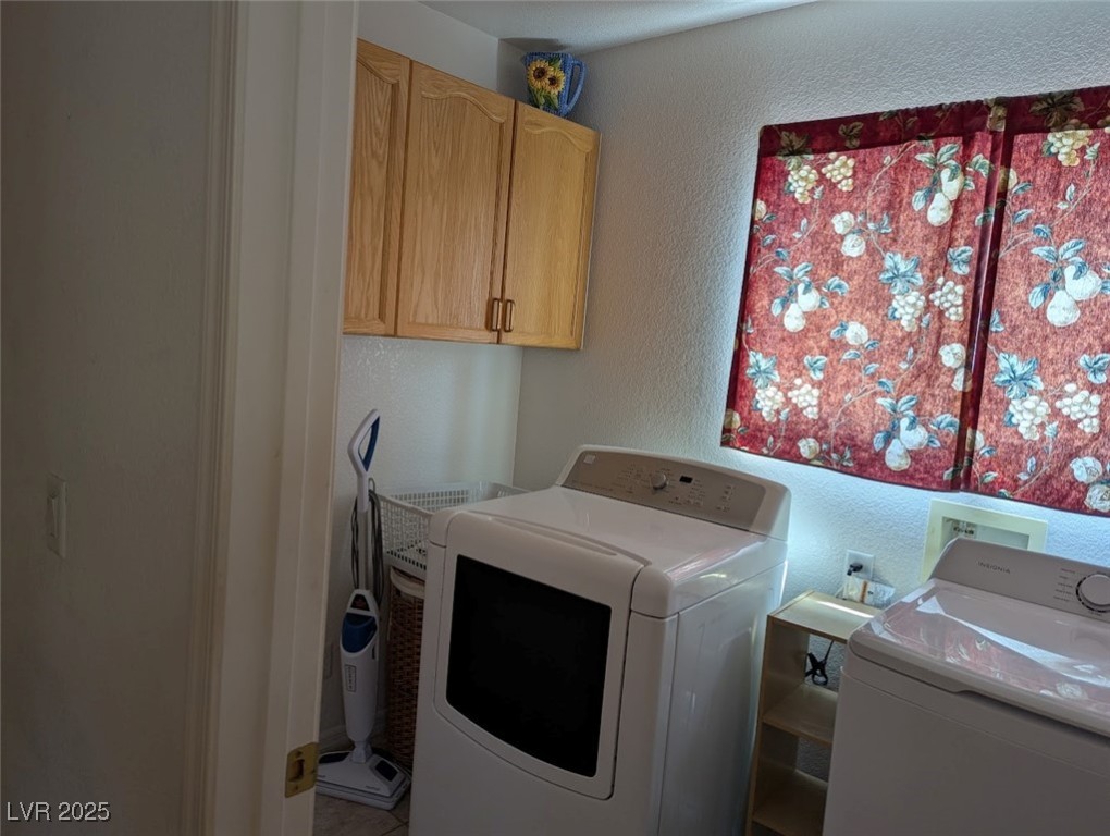 4777 Crakow Court Las Vegas, NV 89147 - Photo 40 of 49 Washroom with a textured wall, cabinet space, and separate washer and dryer