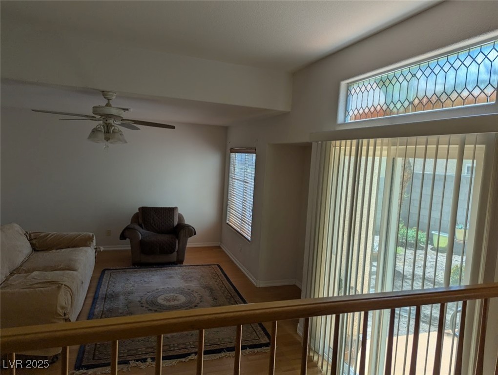 4777 Crakow Court Las Vegas, NV 89147 - Photo 44 of 49 Living room featuring ceiling fan and wood finished floors