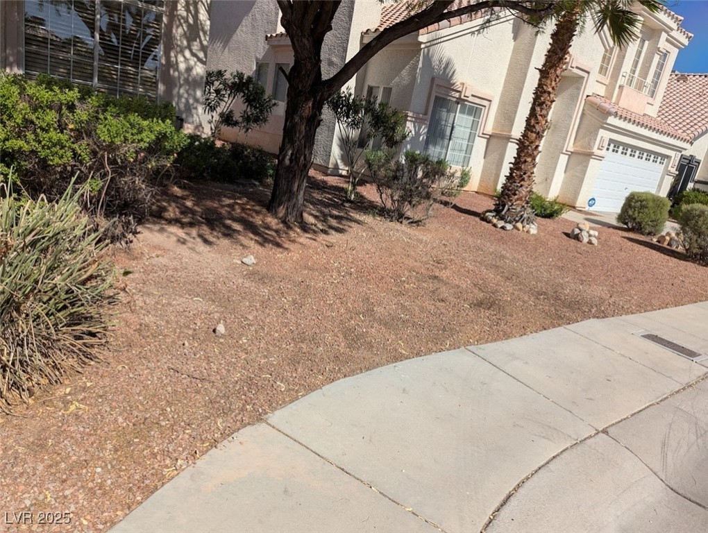 4777 Crakow Court Las Vegas, NV 89147 - Photo 48 of 49 View of yard featuring a garage