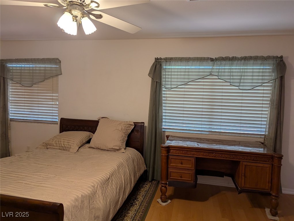 4777 Crakow Court Las Vegas, NV 89147 - Photo 9 of 49 Bedroom featuring wood finished floors and a ceiling fan