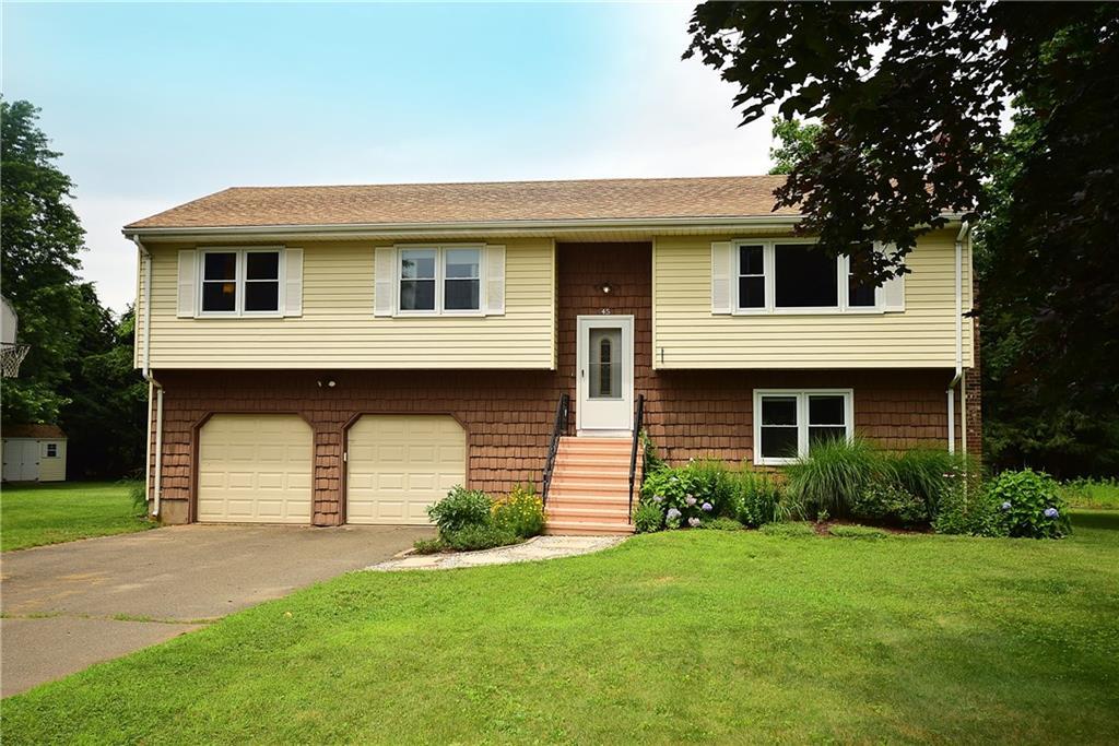45 Randall Circle Windsor, CT 06095 - Photo 1 of 1 a front view of a house with a yard and garage
