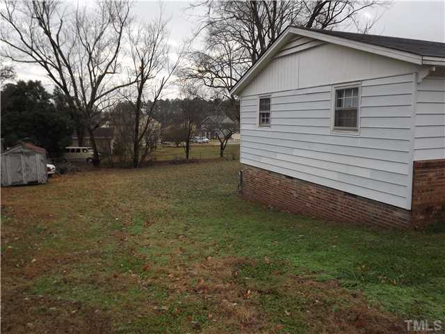 804 Cross Link Road Raleigh, NC 27610 - Photo 5 of 8 a view of a house with a yard