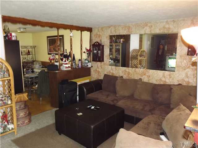 804 Cross Link Road Raleigh, NC 27610 - Photo 8 of 8 a living room with furniture and a large window
