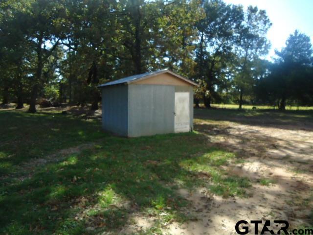 16994-c R 223 C R 223 Arp, TX 75750 - Photo 15 of 38 a backyard of a house with lots of green space