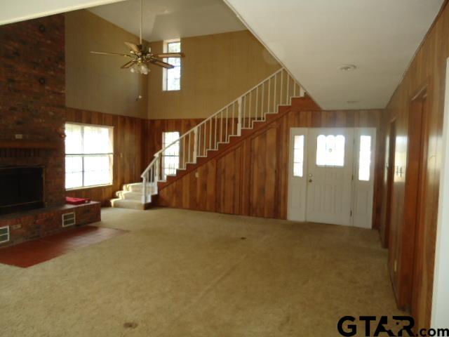 16994-c R 223 C R 223 Arp, TX 75750 - Photo 17 of 38 a view of a livingroom with a staircase