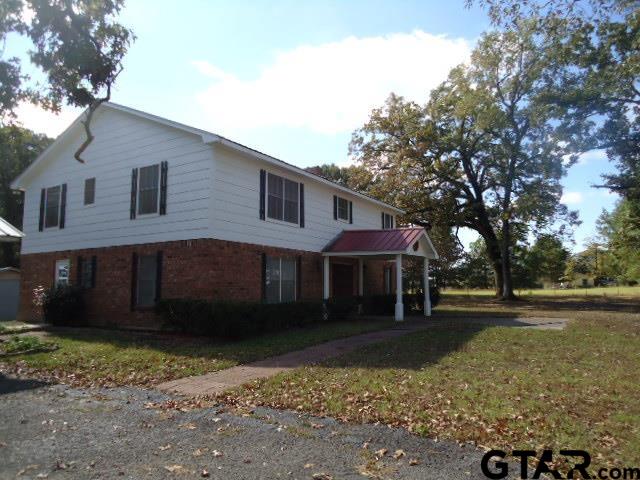 16994-c R 223 C R 223 Arp, TX 75750 - Photo 29 of 38 a front view of a house with a yard