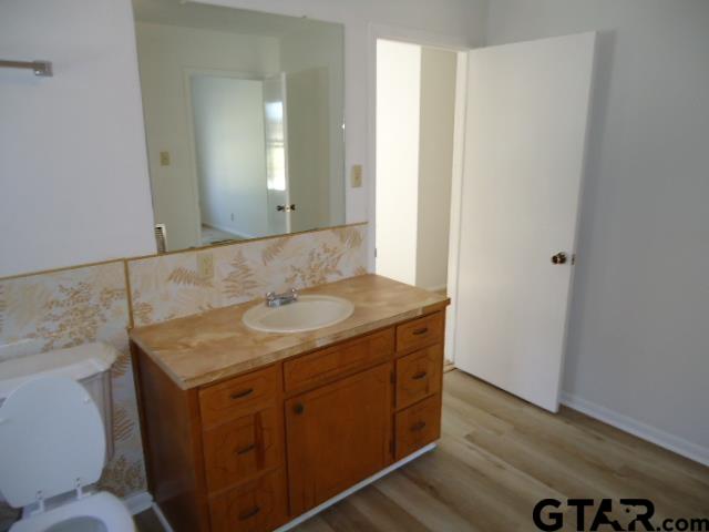 16994-c R 223 C R 223 Arp, TX 75750 - Photo 30 of 38 a bathroom with a granite countertop sink and a mirror