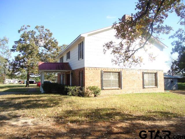 16994-c R 223 C R 223 Arp, TX 75750 - Photo 8 of 38 a front view of a house with a yard