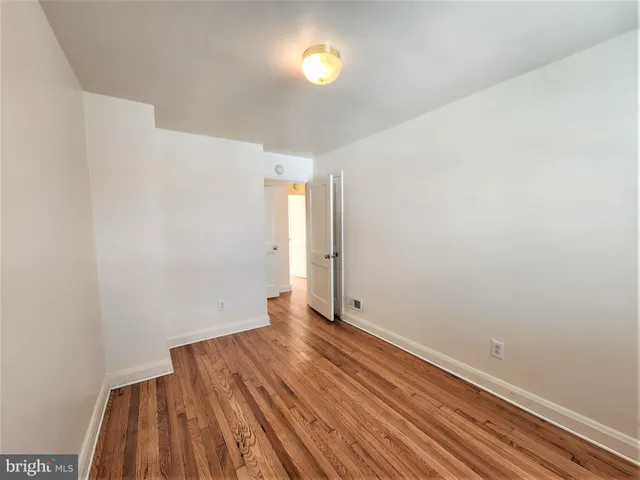 a view of room with wooden floor