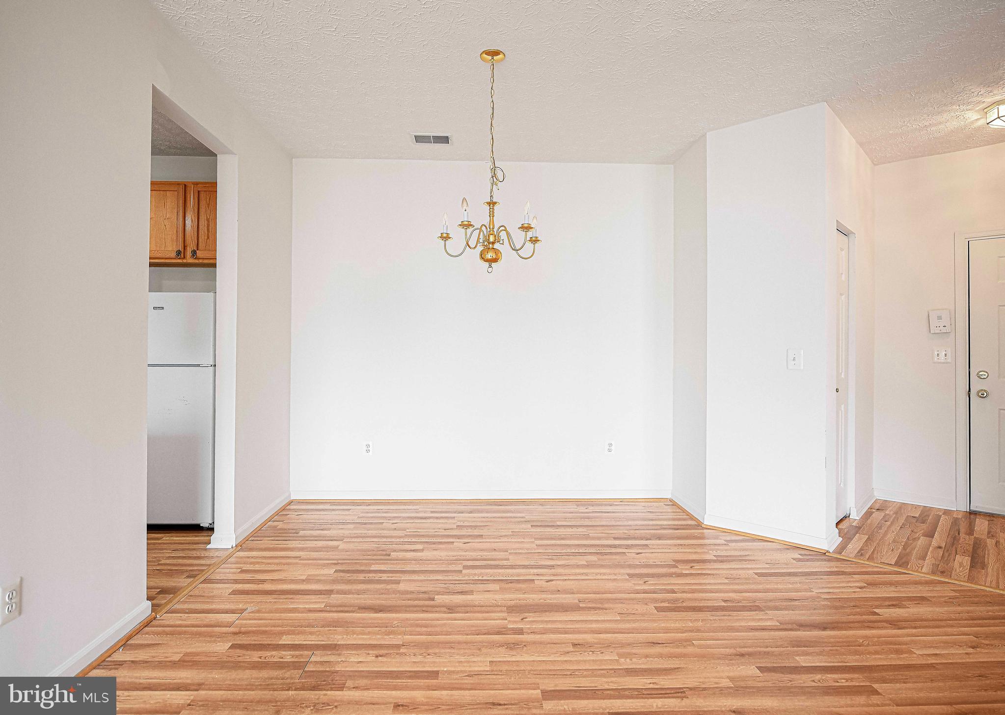 9606 Haven Farm Road, Unit E Perry Hall, MD 21128 - Photo 12 of 33 a view of a room with wooden floor and ceiling fan