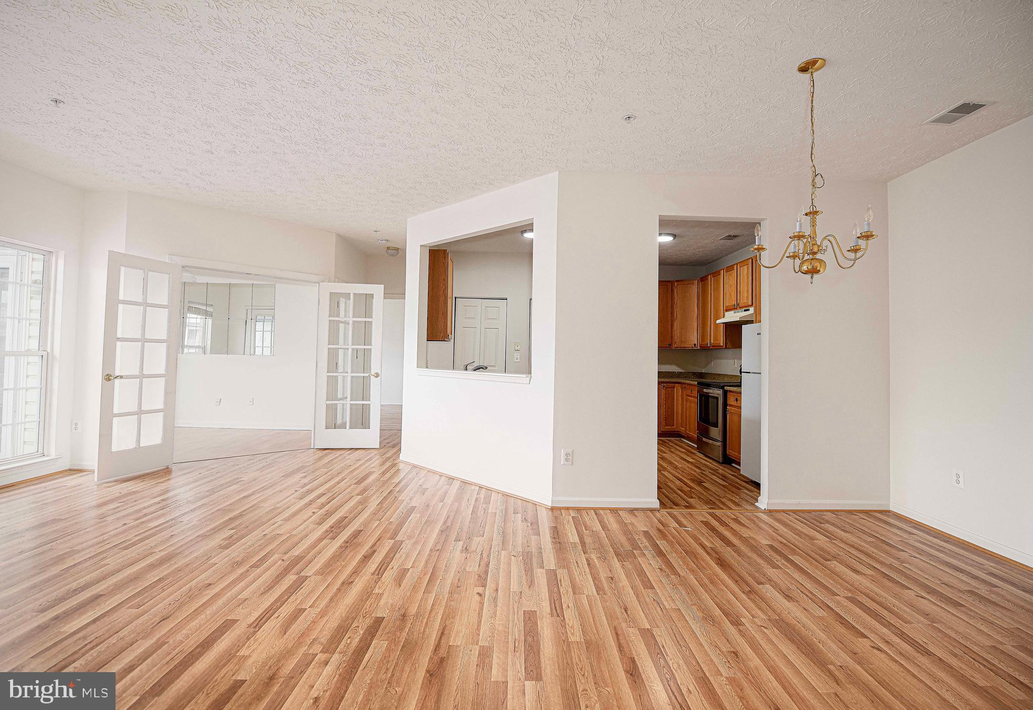 9606 Haven Farm Road, Unit E Perry Hall, MD 21128 - Photo 13 of 33 a view of empty room with wooden floor and fan