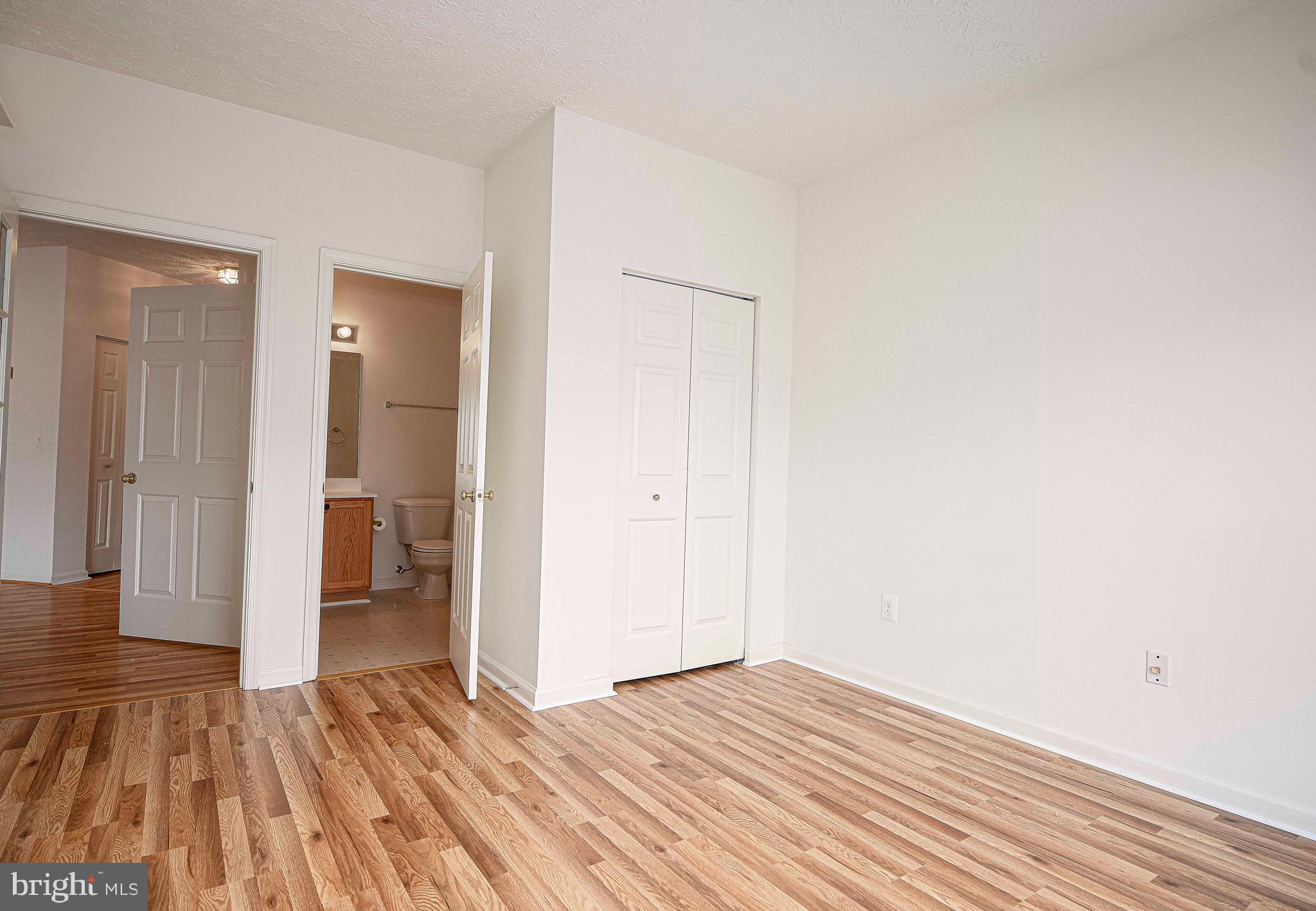 9606 Haven Farm Road, Unit E Perry Hall, MD 21128 - Photo 16 of 33 a view of a room with wooden floor and a bathroom