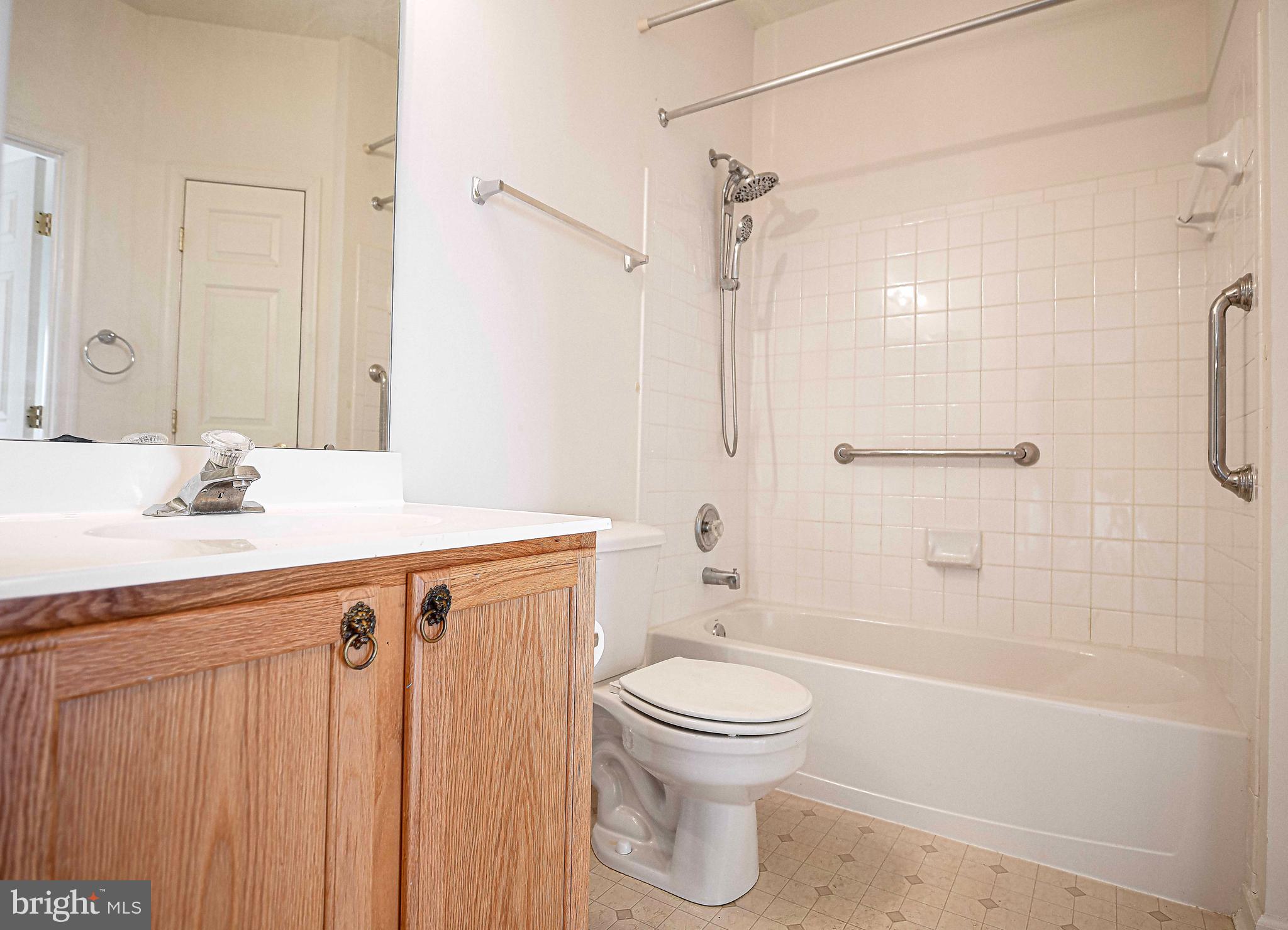 9606 Haven Farm Road, Unit E Perry Hall, MD 21128 - Photo 17 of 33 a bathroom with a sink a toilet and shower